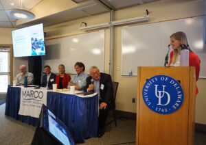 A view of six speakers on the closing panel